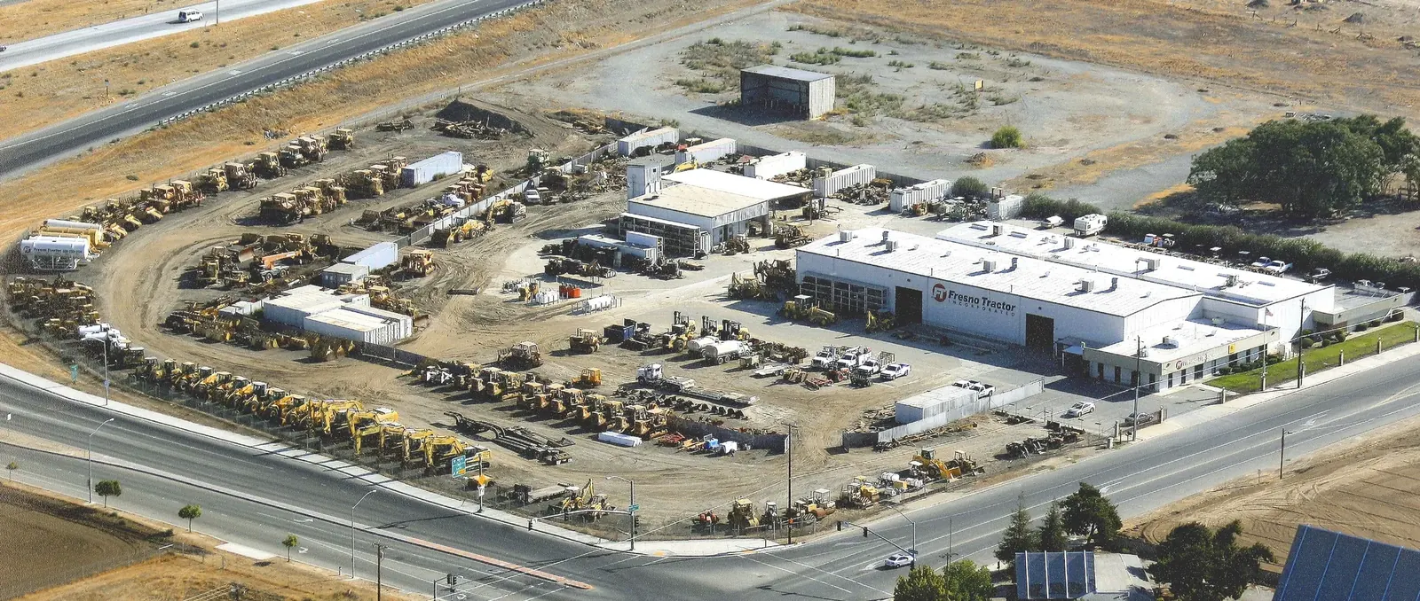 Aerial view of the Fresno Tractor Inc facility and equipment yard